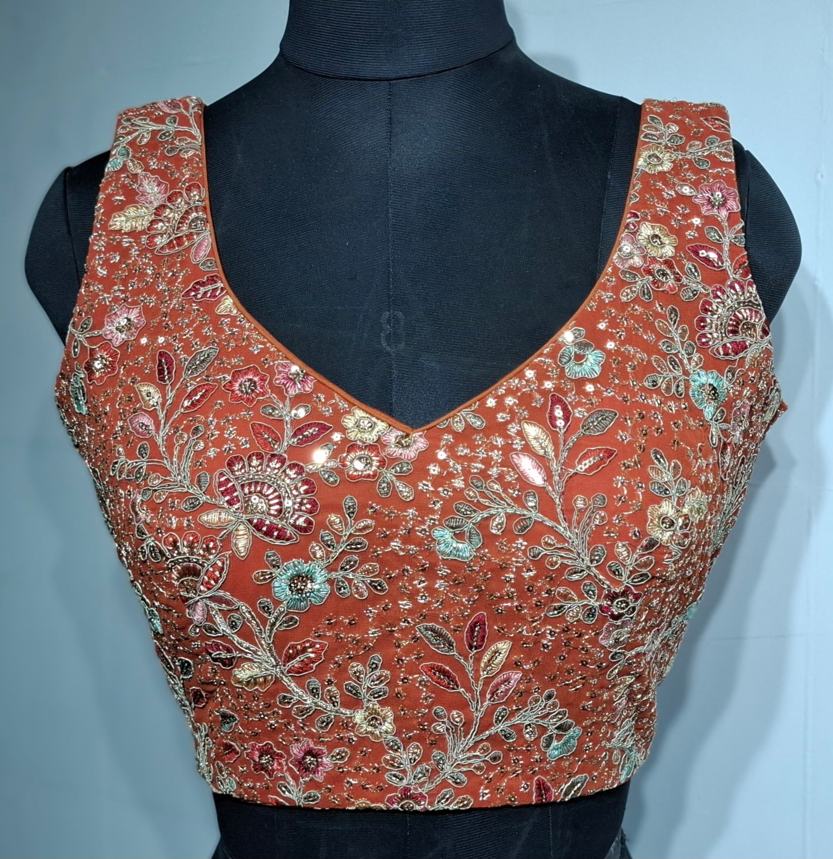 Rust georgette readymade blouse with multi-color embroidery and sequins
