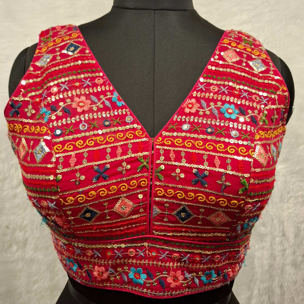 Hot pink readymade blouse with multi-color embroidery, sequins, and mirror work, V-neck back-open style