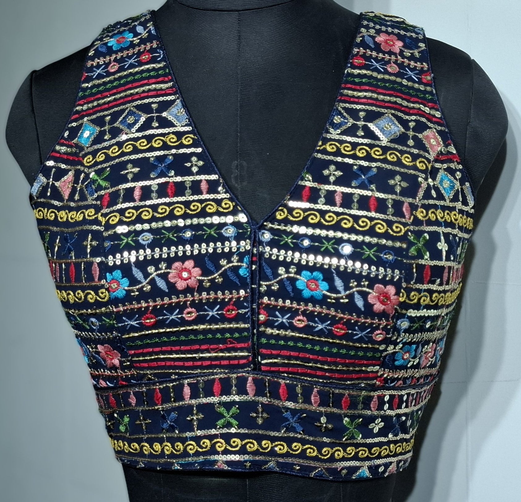 Navy blue readymade blouse with multi-color embroidery, sequins, and foil mirror work