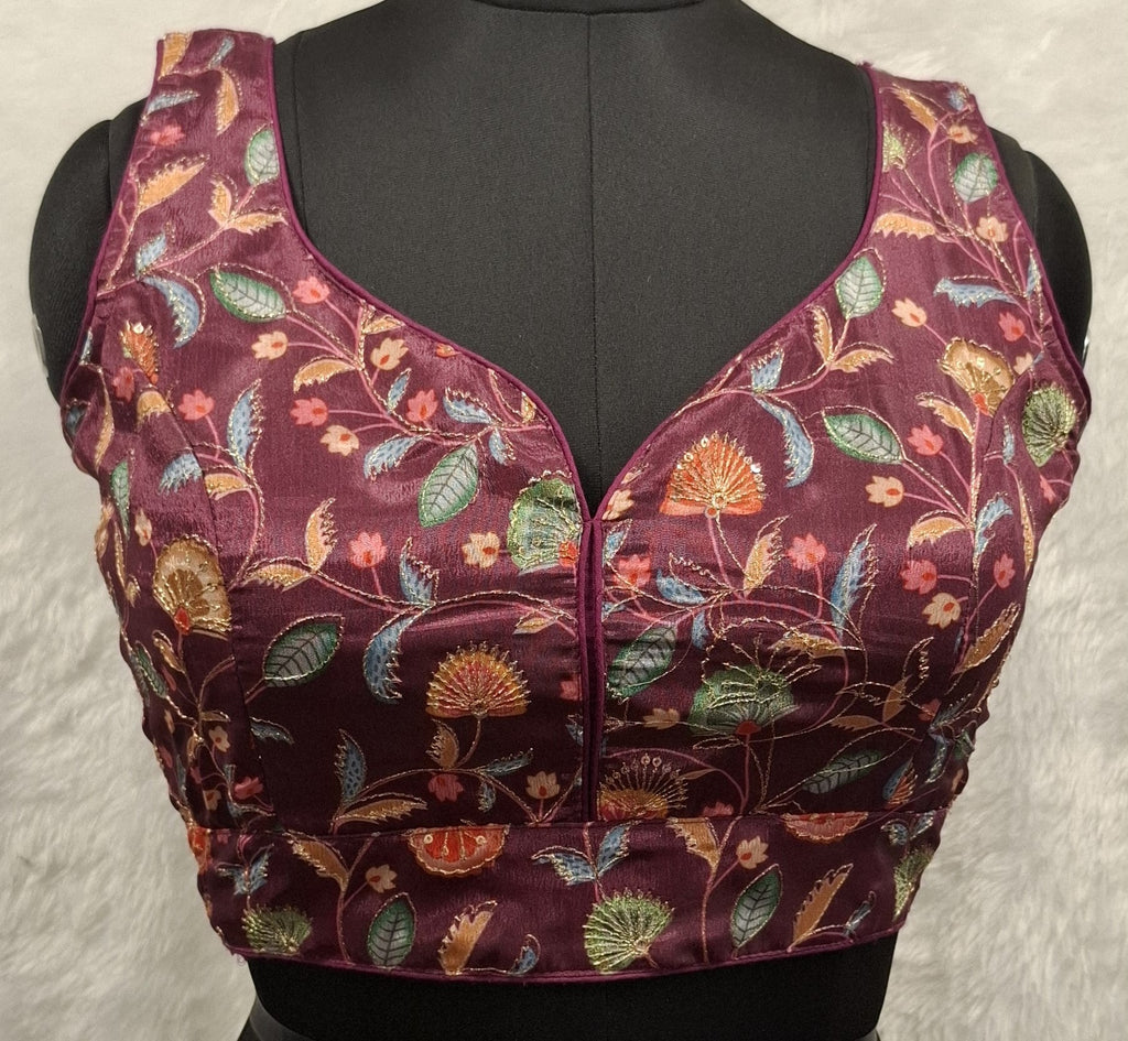 Wine colored saree blouse featuring sequin and Zari embroidery with sweetheart neckline