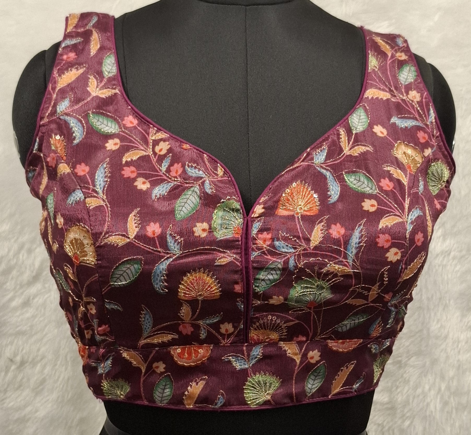 Wine colored saree blouse featuring sequin and Zari embroidery with sweetheart neckline