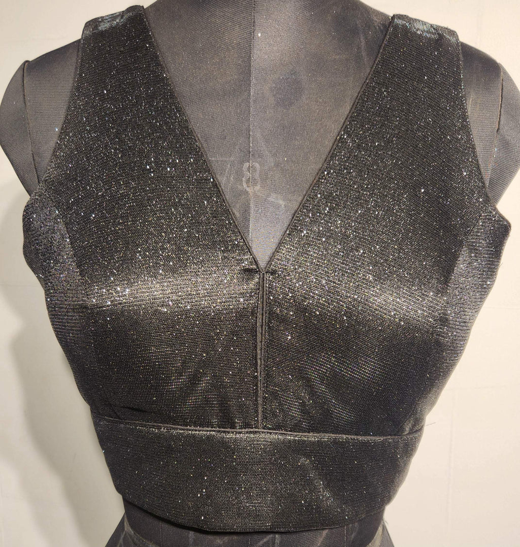 Black shimmer fabric blouse with gold glitter and V-neckline