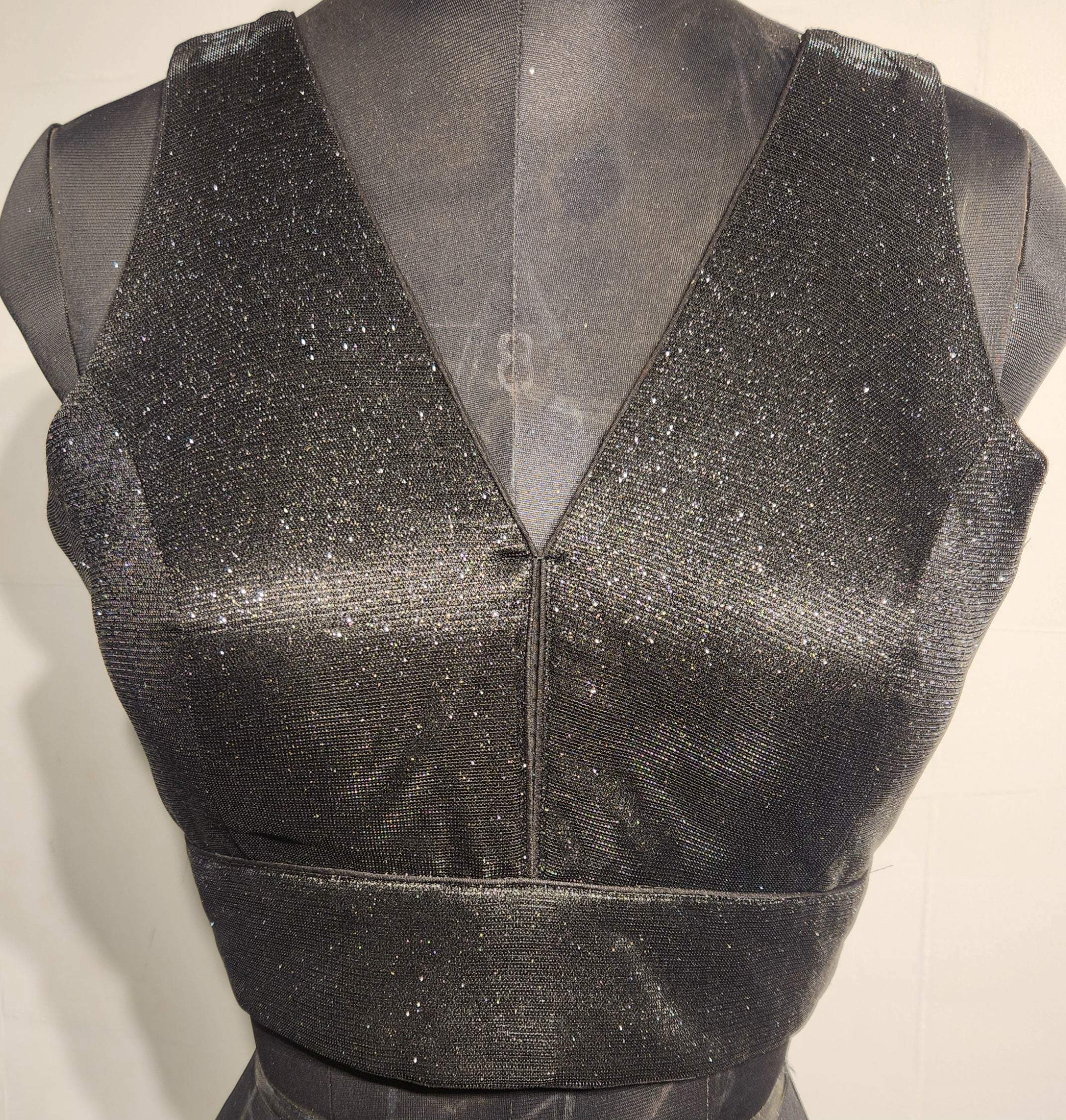 Black shimmer fabric blouse with gold glitter and V-neckline