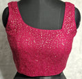 Hot pink net blouse with golden sequins and asymmetrical neckline