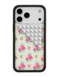 iPhone case with a soft yellow background, multi-colored floral bouquet pattern, and silver pyramid stud embellishments on a black border frame.