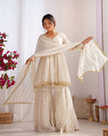 Off White Mal Chanderi Silk Sharara Suit with mirror work embroidery and full-flair palazzo