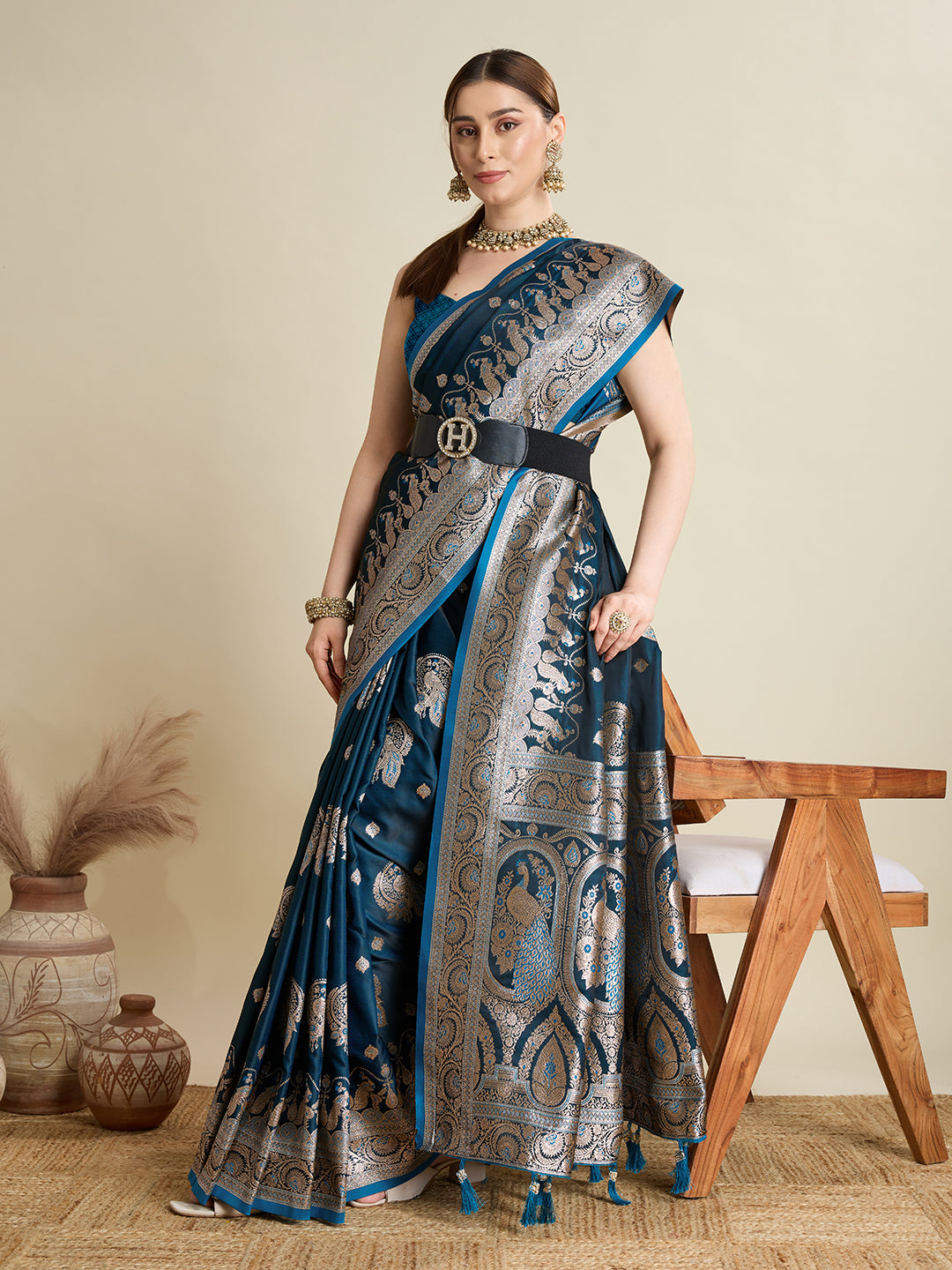 Deep Teal Blue satin wedding saree with shimmering zari motifs and an elaborate pallu.