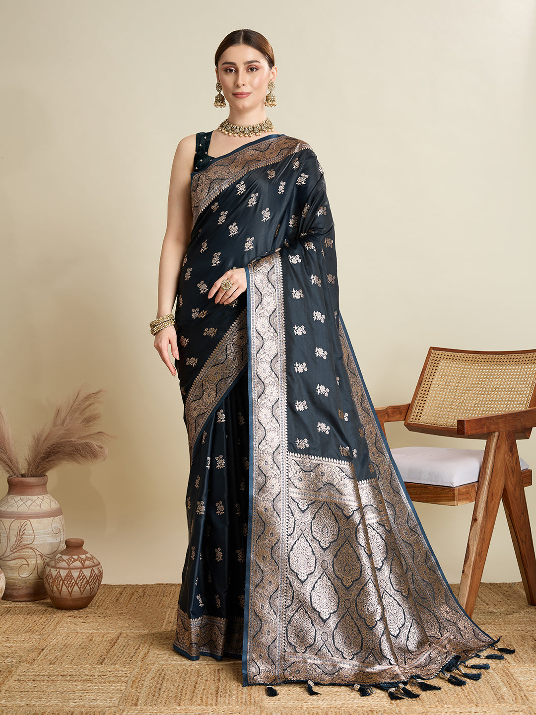 Black satin saree with gold Jari motifs and matching unstitched blouse