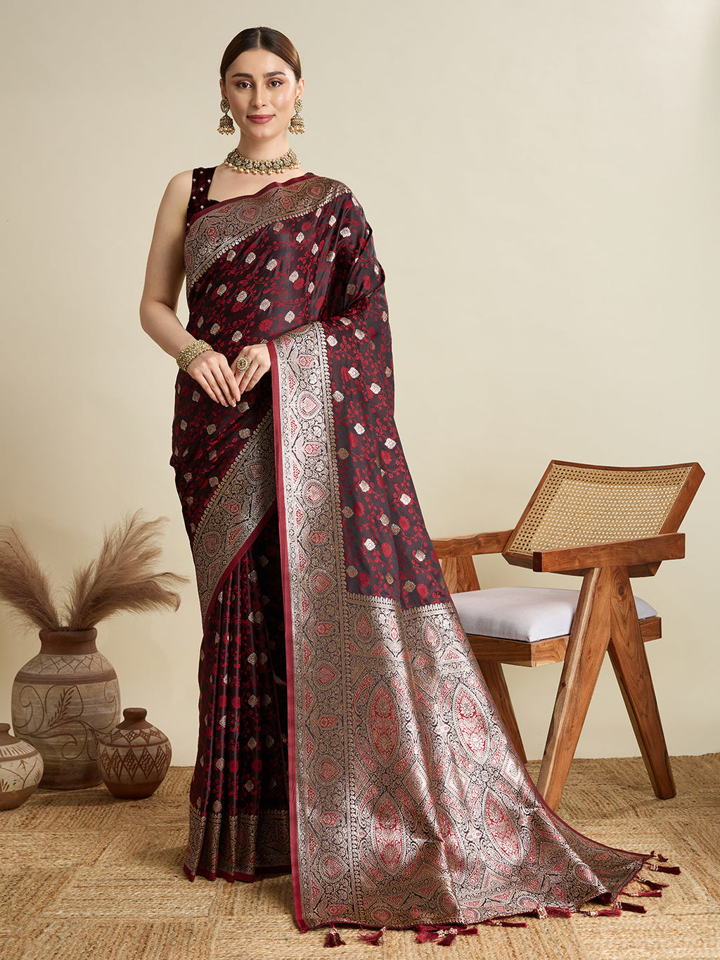 Deep Maroon satin wedding saree with golden Jari motifs throughout the pallu.
