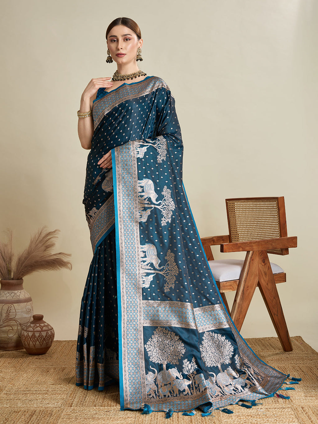 Teal blue satin wedding saree with detailed zari work on pallu