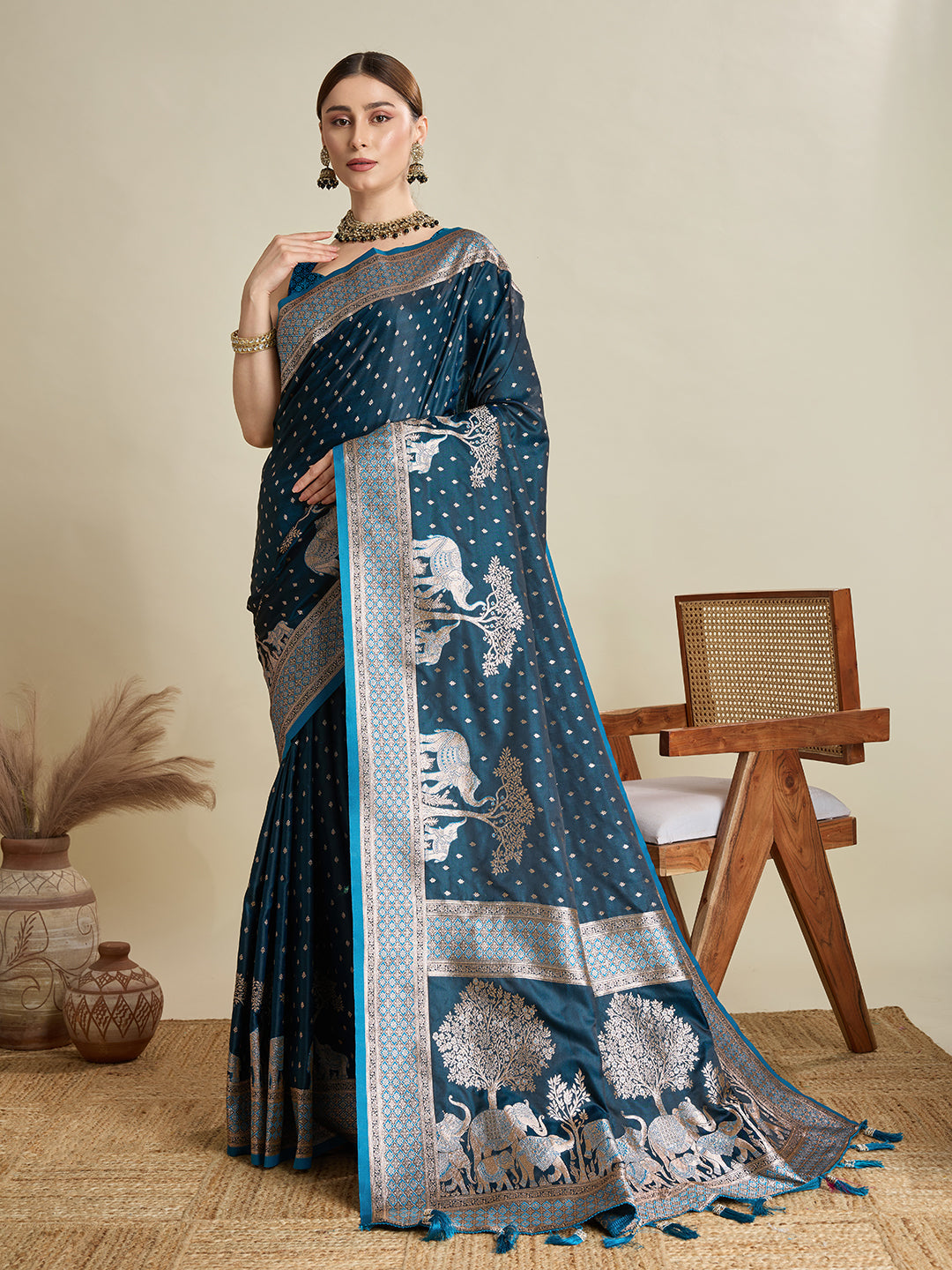 Teal blue satin wedding saree with detailed zari work on pallu
