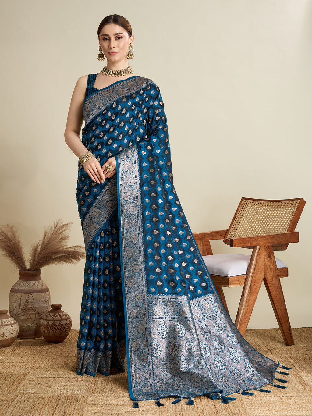 Peacock Blue satin wedding saree with golden jari motifs and unstitched blouse.