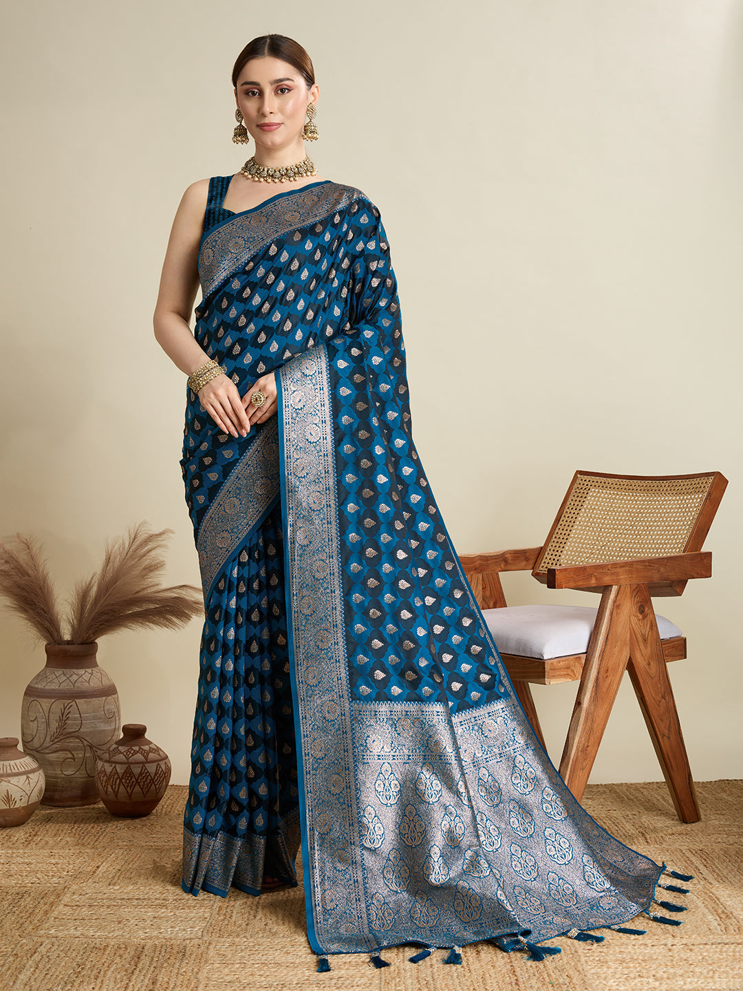 Peacock Blue satin wedding saree with golden jari motifs and unstitched blouse.