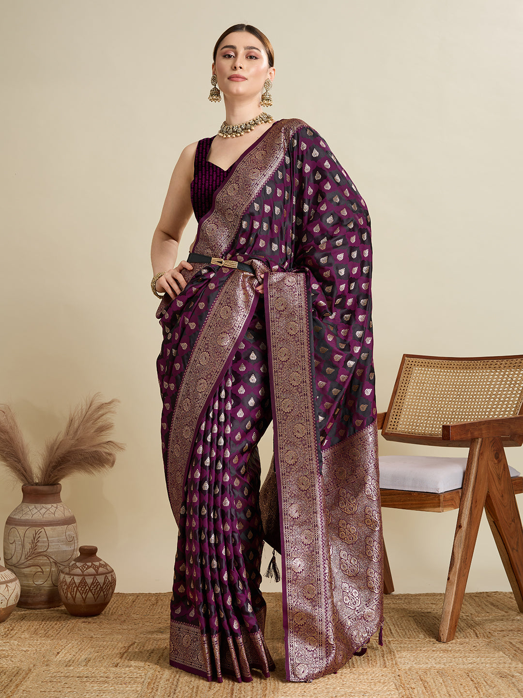 Dark purple satin saree featuring intricate Jari embroidery and an unstitched blouse piece
