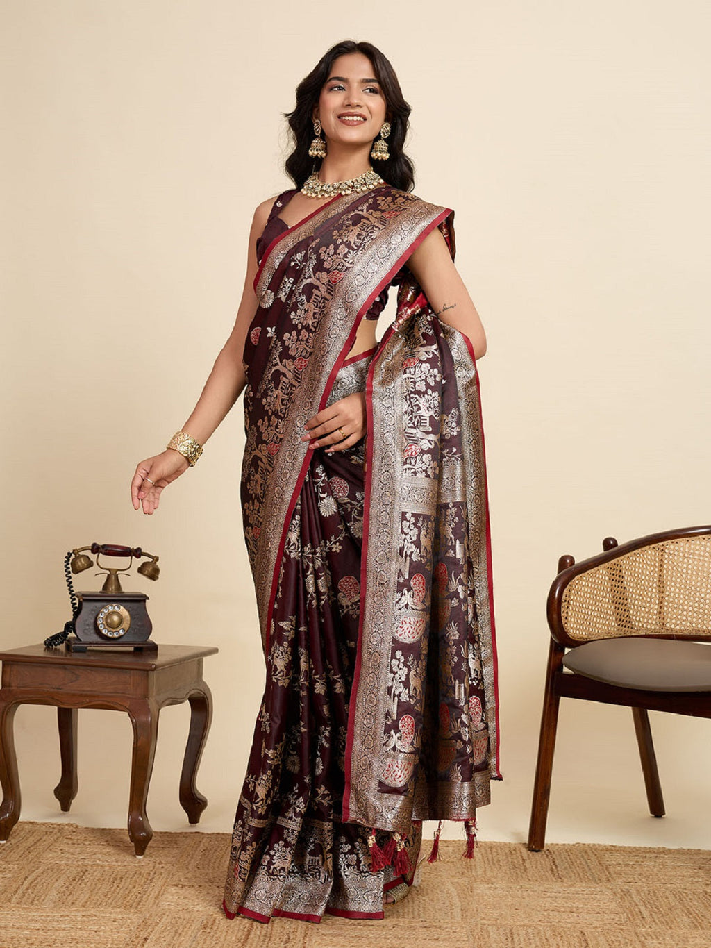 Deep Maroon Satin saree with all-over gold Jari motifs and matching pallu.