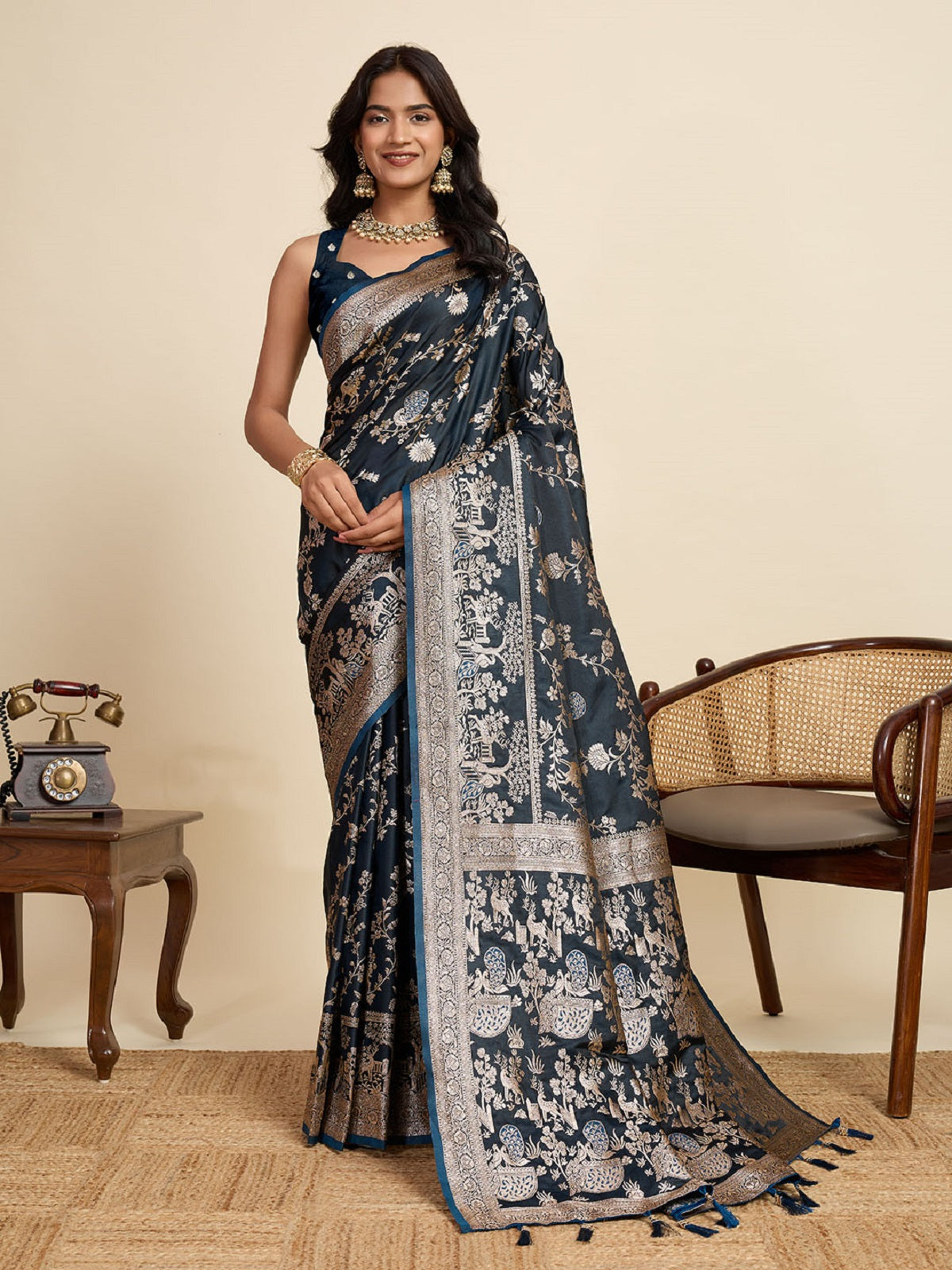 Teal blue satin saree with gold jari motifs on the pallu and body
