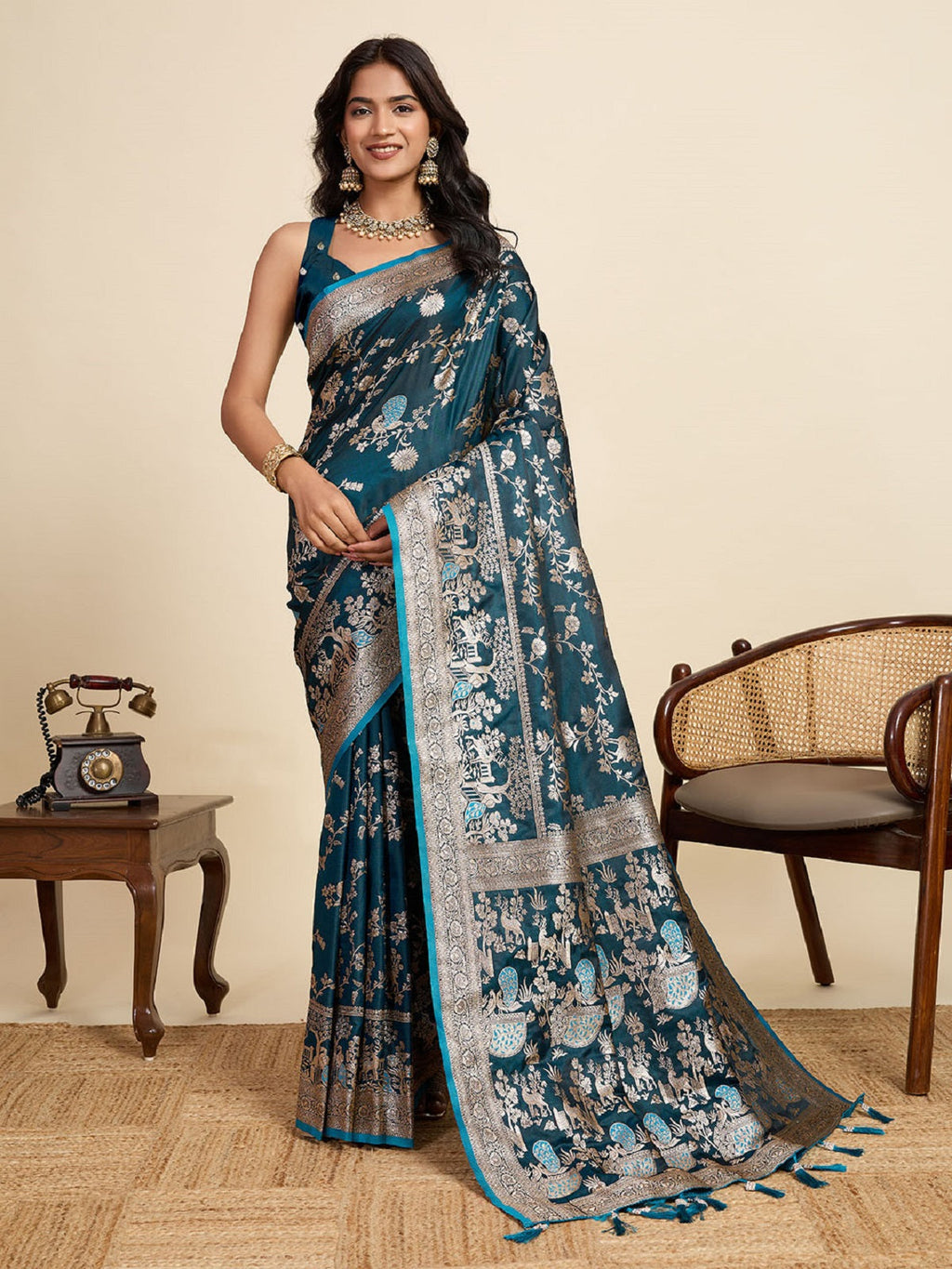 Teal Blue satin saree with intricate Jari motif work and matching unstitched blouse piece.