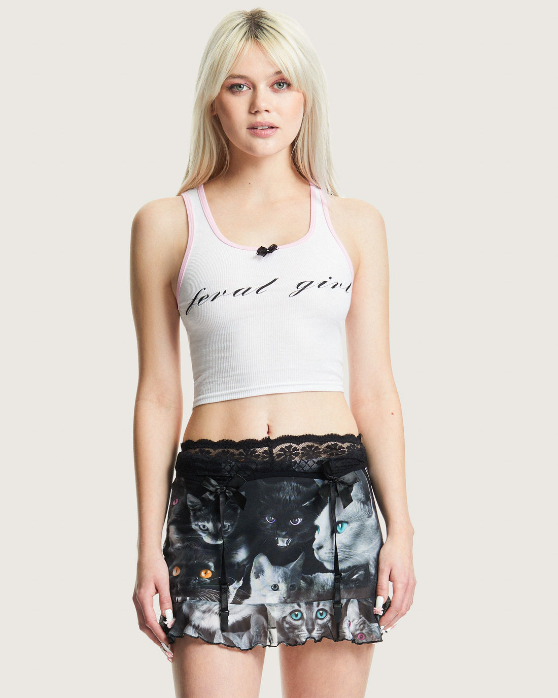 White cropped baby rib tank top with pink trim and black Feral Girl script graphic