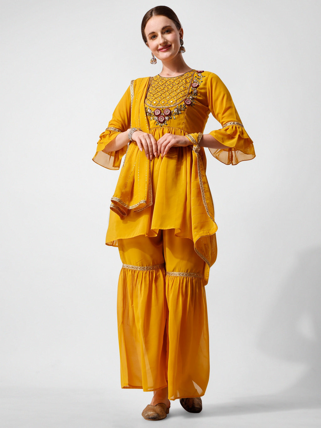 Multicolor hand-embroidered kurta paired with matching sharara pants and a dupatta.