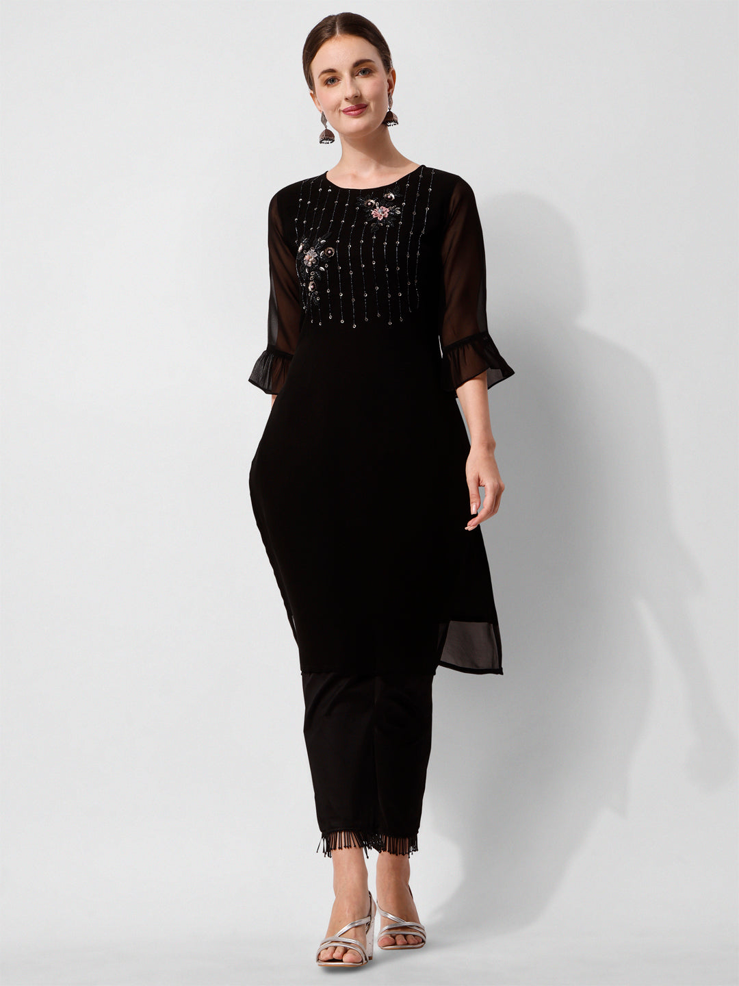 Model wearing a black georgette-style kurta with pants and a colorful printed dupatta