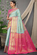Sky blue Kanjivaram silk saree with Zari woven pattern and contrast pink blouse