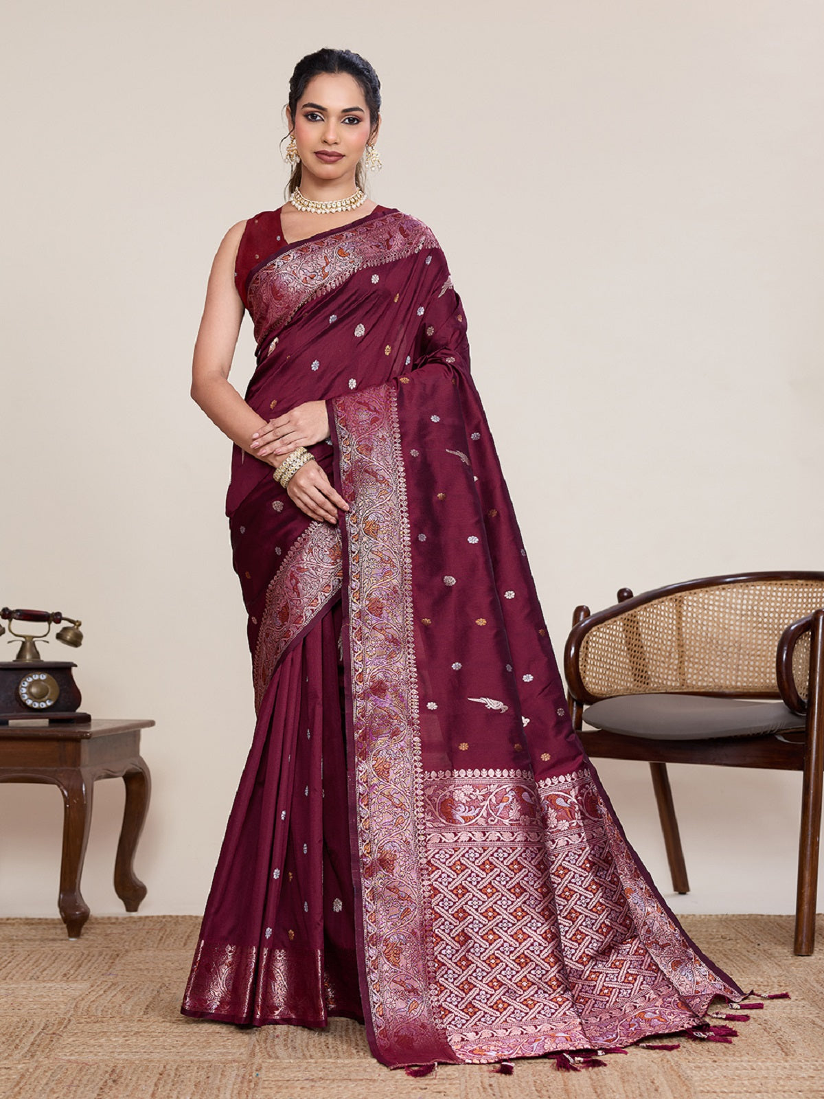 Deep maroon Kanjivaram silk wedding saree with silver and gold jari jacquard work