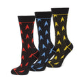 Three pairs of black crew socks with red, blue, and yellow Star Trek delta shield patterns displayed next to a branded gift box.