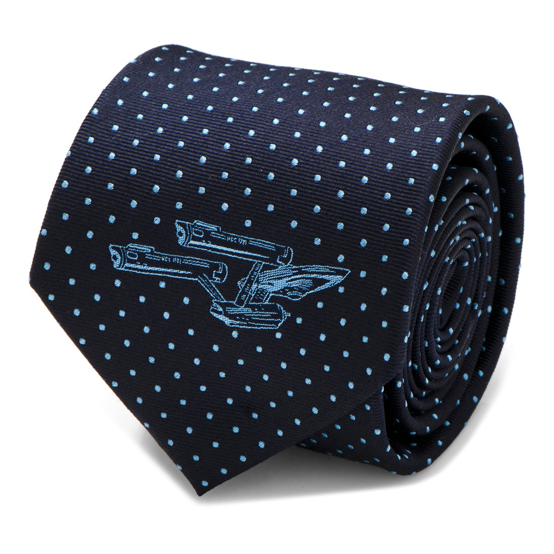 Close up of navy blue silk necktie with azure dots and USS Enterprise ship icon