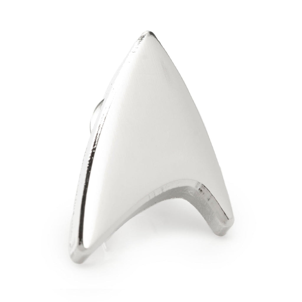 Close-up of a silver Star Trek Delta Shield lapel pin on a plain white background