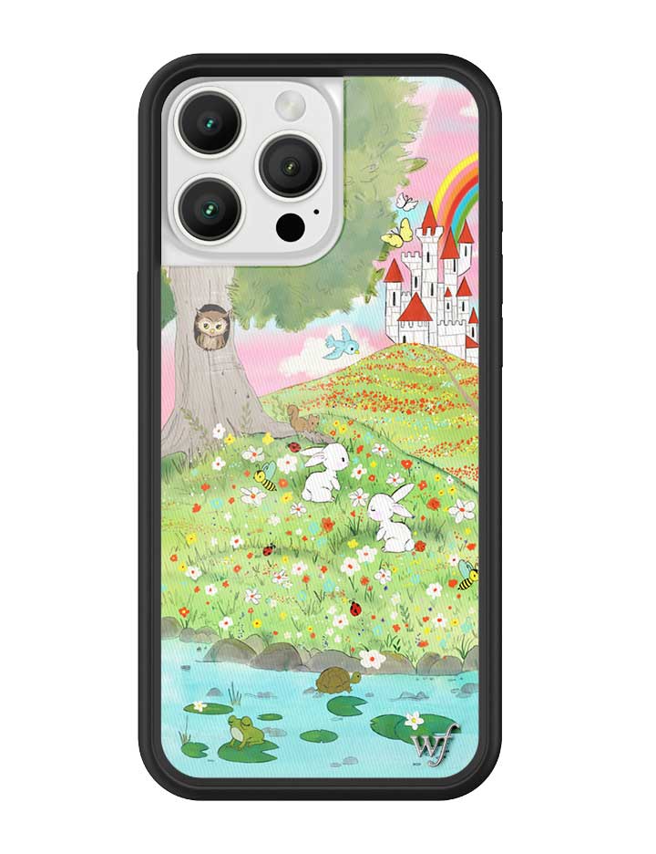Fairytale themed iPhone case with storybook illustration featuring a castle, bunnies, and a rainbow, framed by a black rubber bumper.