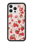 iPhone case featuring a pattern of strawberries and small flowers on a pale pink background with a protective black bumper.