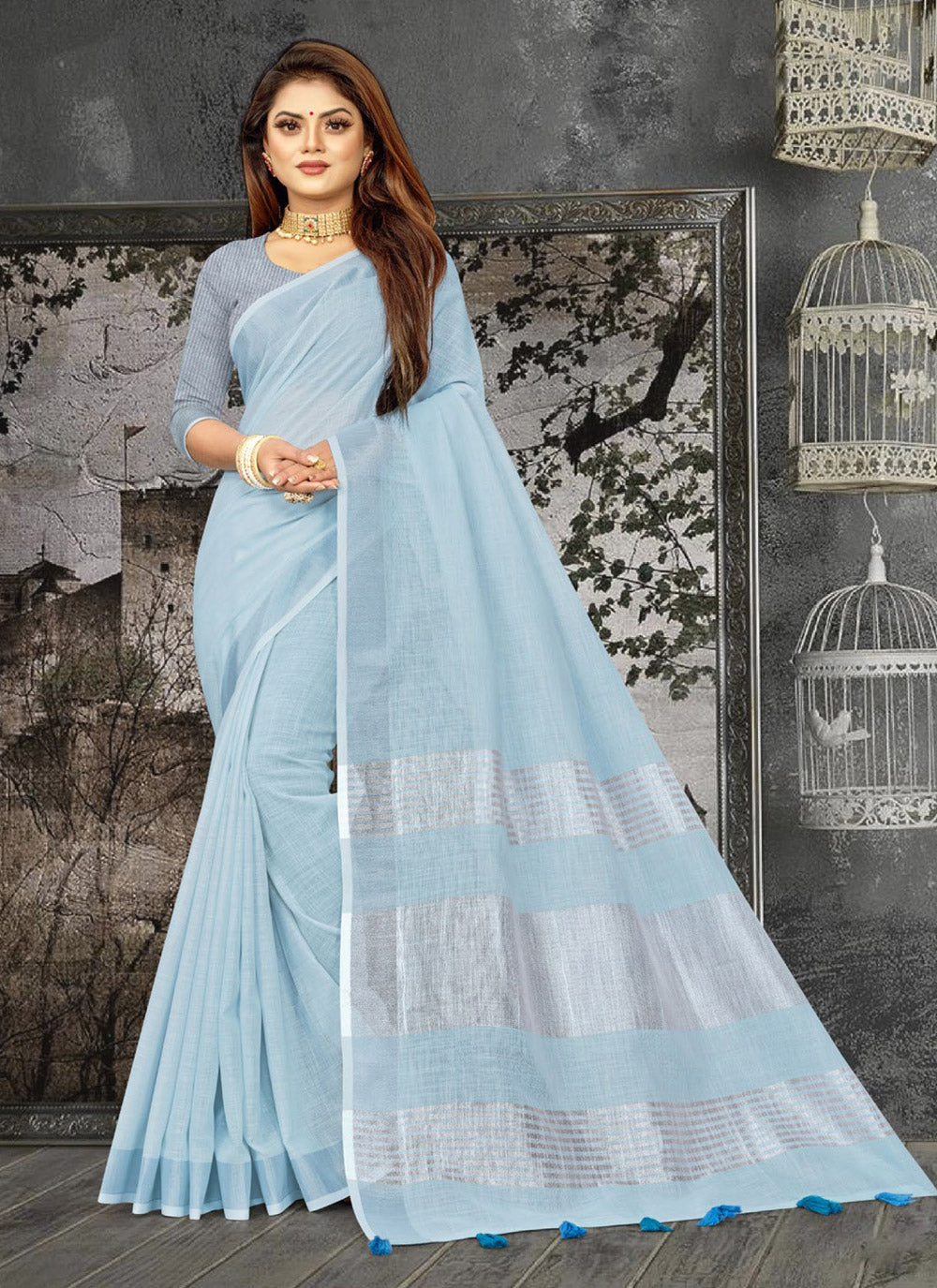 Elegant Sky Blue woven linen saree with contrast zari border and decorative tassels