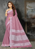 Elegant mauve linen saree with gold zari border and decorative pallu tassels