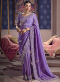 Regal purple silk embroidered saree with ornate lace border