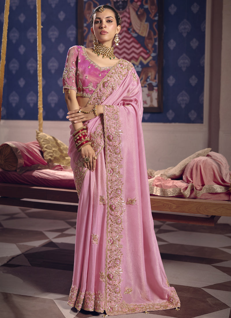 Romantic light_pink silk saree with heavy lace border, perfect for wedding guest attire.