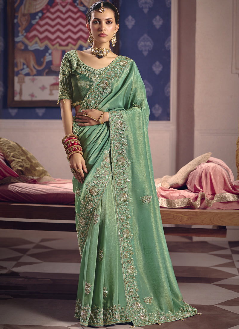 Dark Green Silk Saree with elegant heavy lace border for festive occasions
