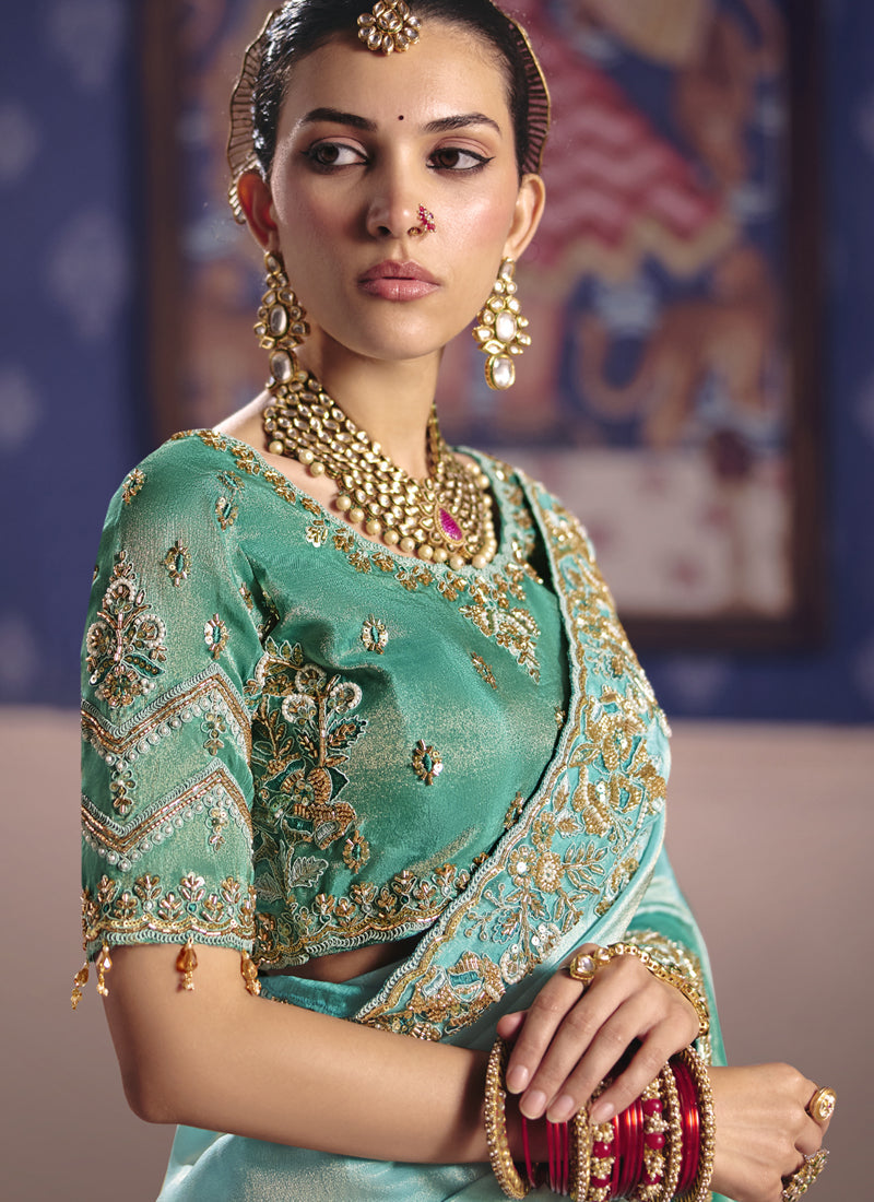 Turquoise Silk Embroidered Saree with Heavy Lace Border