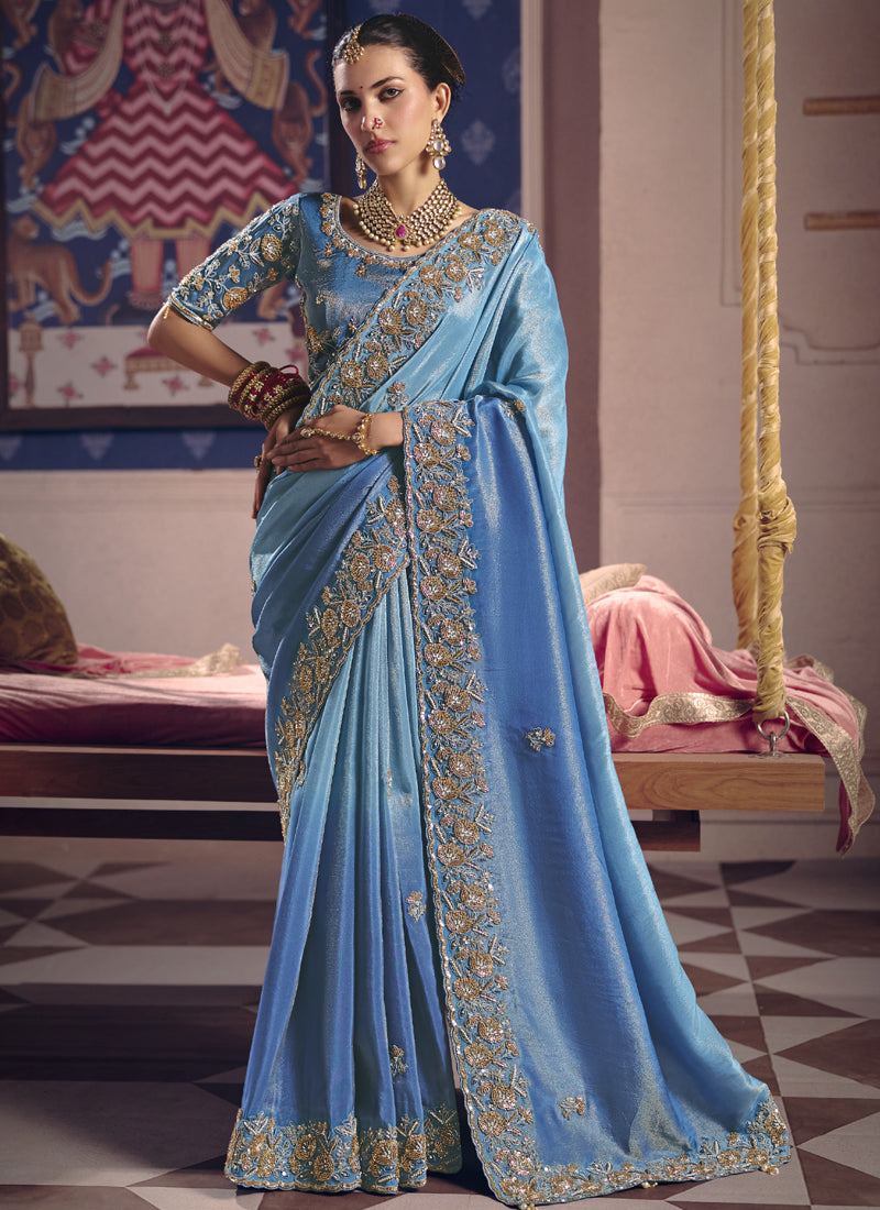 Sky blue silk embroidered saree with delicate heavy lace border