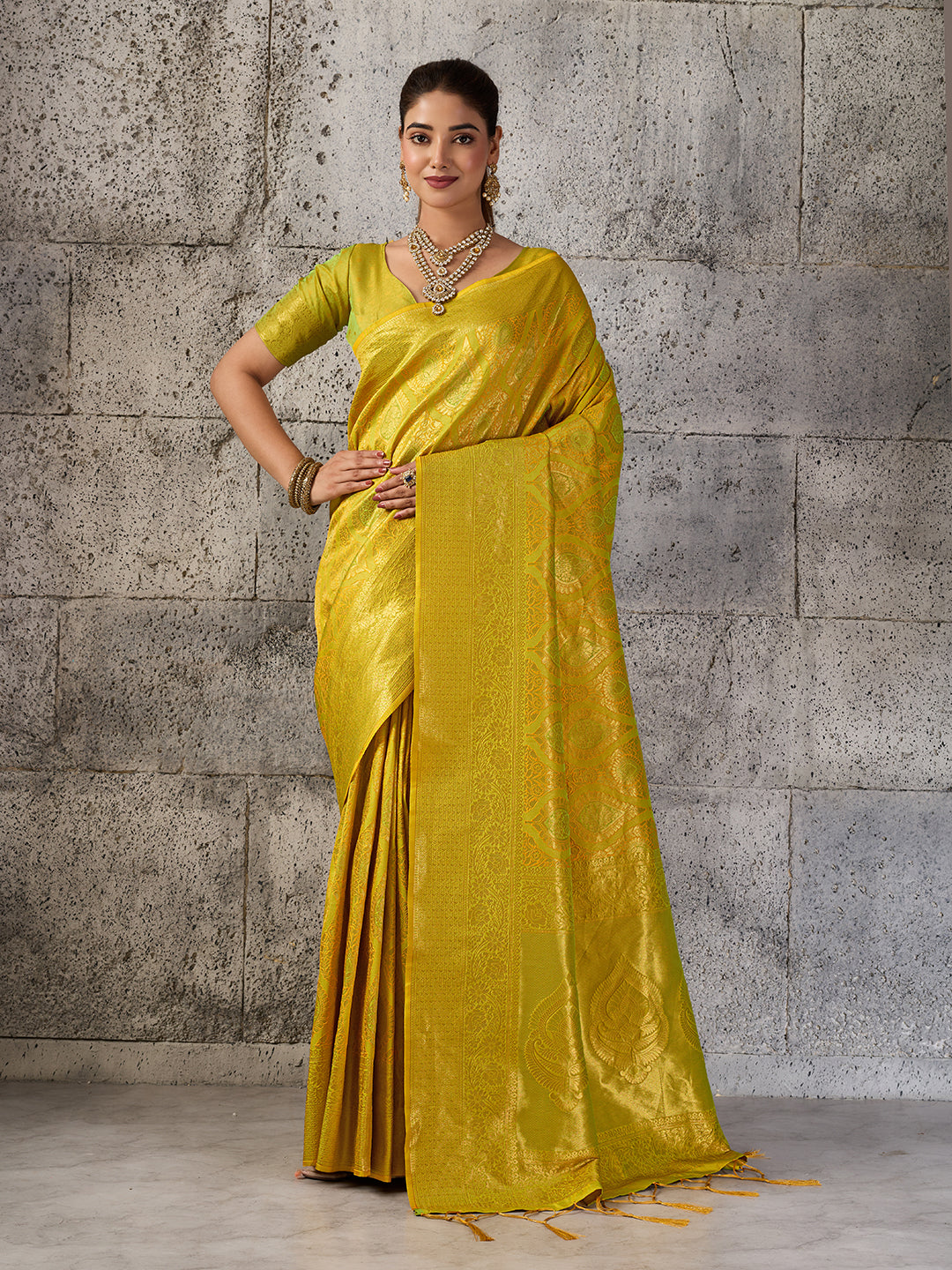 Mustard yellow traditional Kanjivaram silk blend saree for festive occasions