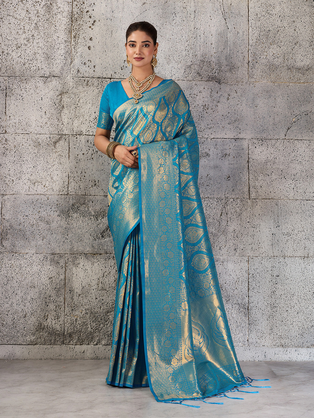 Elegant teal blue Kanjivaram silk blend fancy saree with traditional border