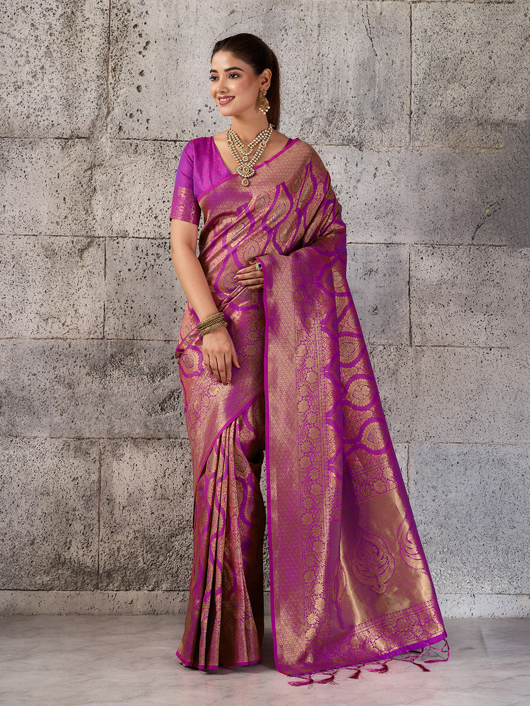 Vibrant magenta Kanjivaram silk blend fancy saree with intricate design