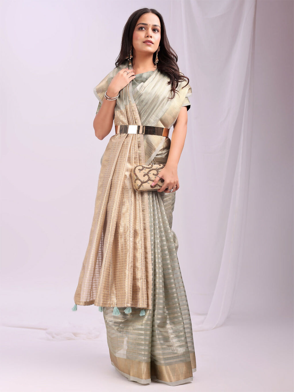Sophisticated grey organza saree with a matching blouse, ideal for formal evening events.