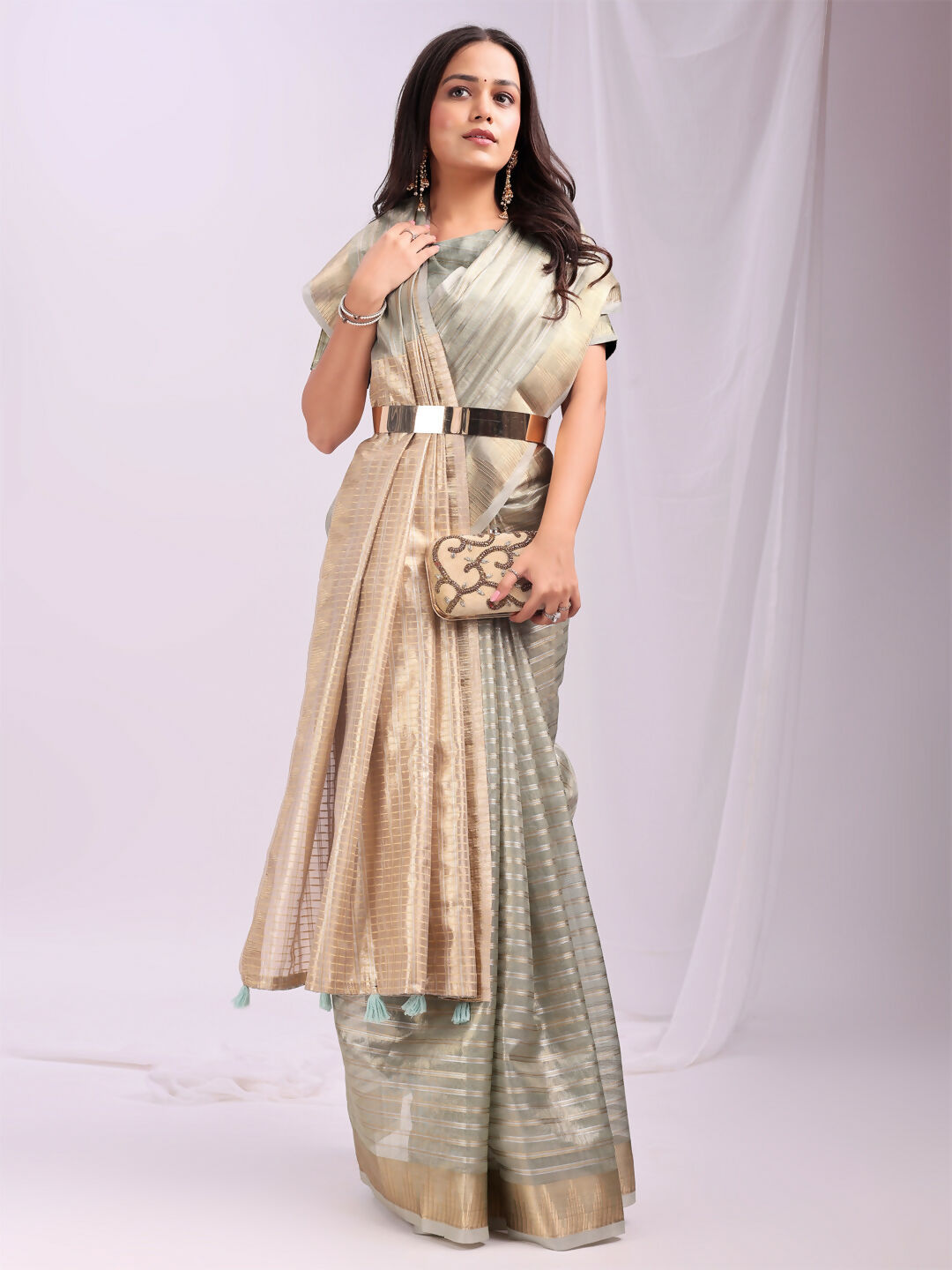 Sophisticated grey organza saree with a matching blouse, ideal for formal evening events.