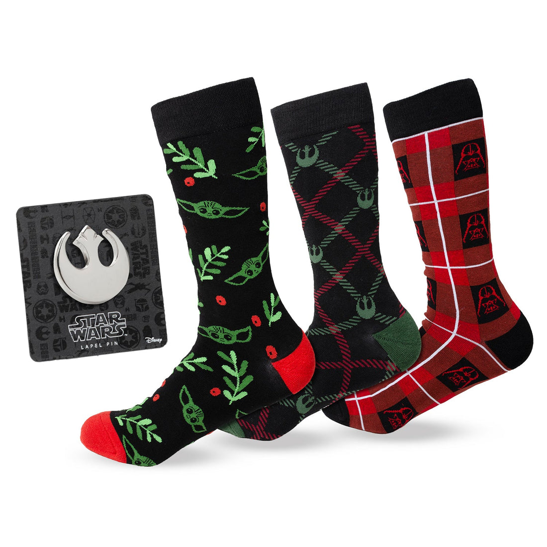 Three pairs of Star Wars holiday crew socks including Grogu, Rebel Alliance, and Darth Vader patterns, alongside a silver Rebel Alliance lapel pin.