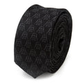 A black silk skinny tie with a subtle repeating pattern of Darth Vader helmet outlines.