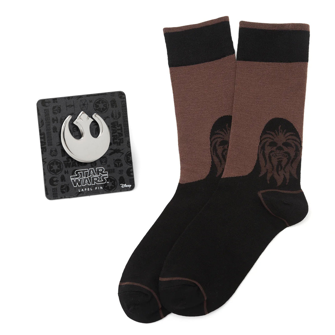 A Star Wars gift set containing brown and black Chewbacca crew socks and a silver-toned Rebel Alliance Starbird crest lapel pin.