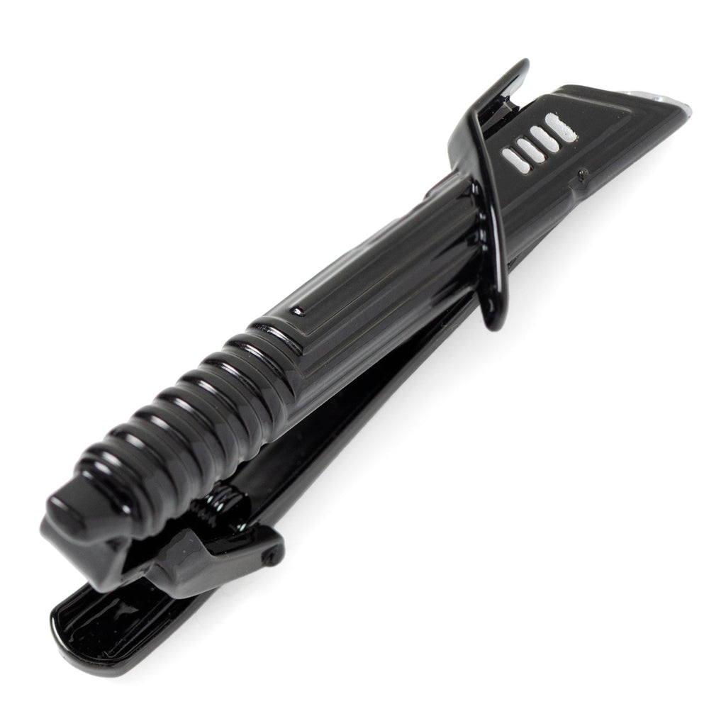 Close up of a black and silver Darksaber tie clip showing the textured handle and blade details.