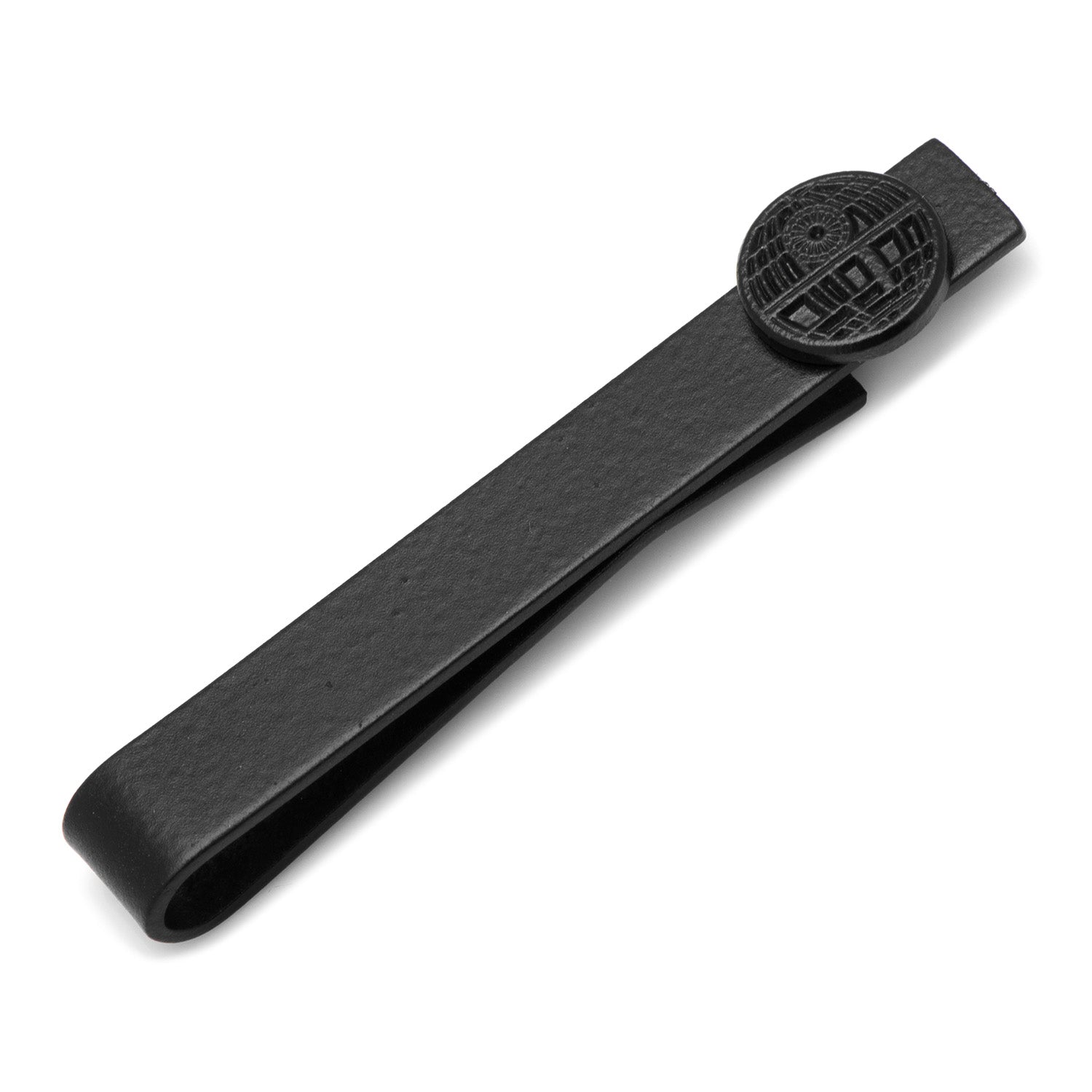 A close-up view of a black metal tie bar with a circular Death Star emblem on one end against a white background.