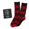 Red and black Star Wars crew socks with Darth Vader design next to a Darth Vader lapel pin on a display card.