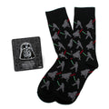 Black crew socks featuring a pattern of Darth Vader and Luke Skywalker dueling with lightsabers, next to a Darth Vader lapel pin.